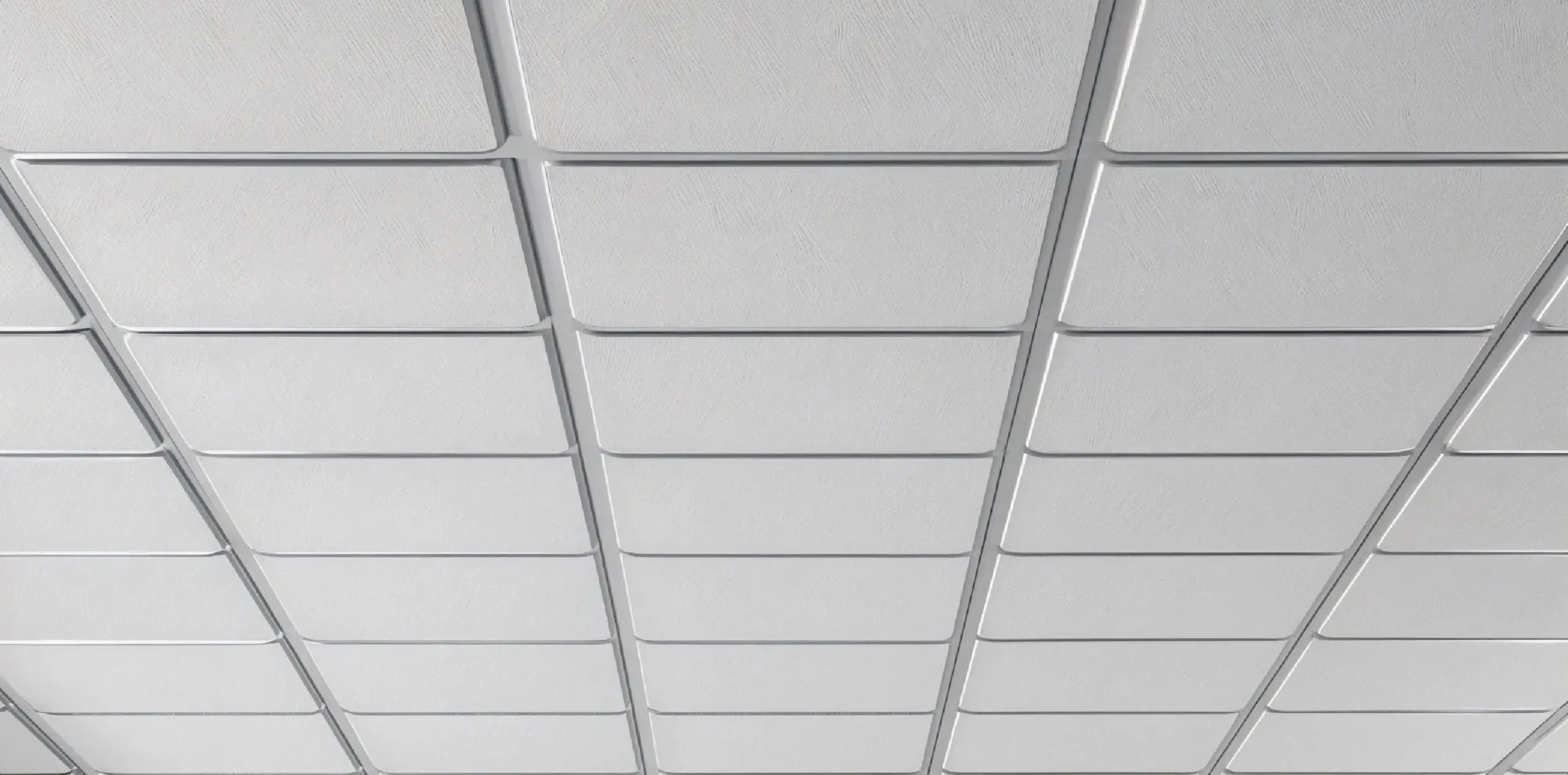 A white grid ceiling with lay-in tiles seen from below