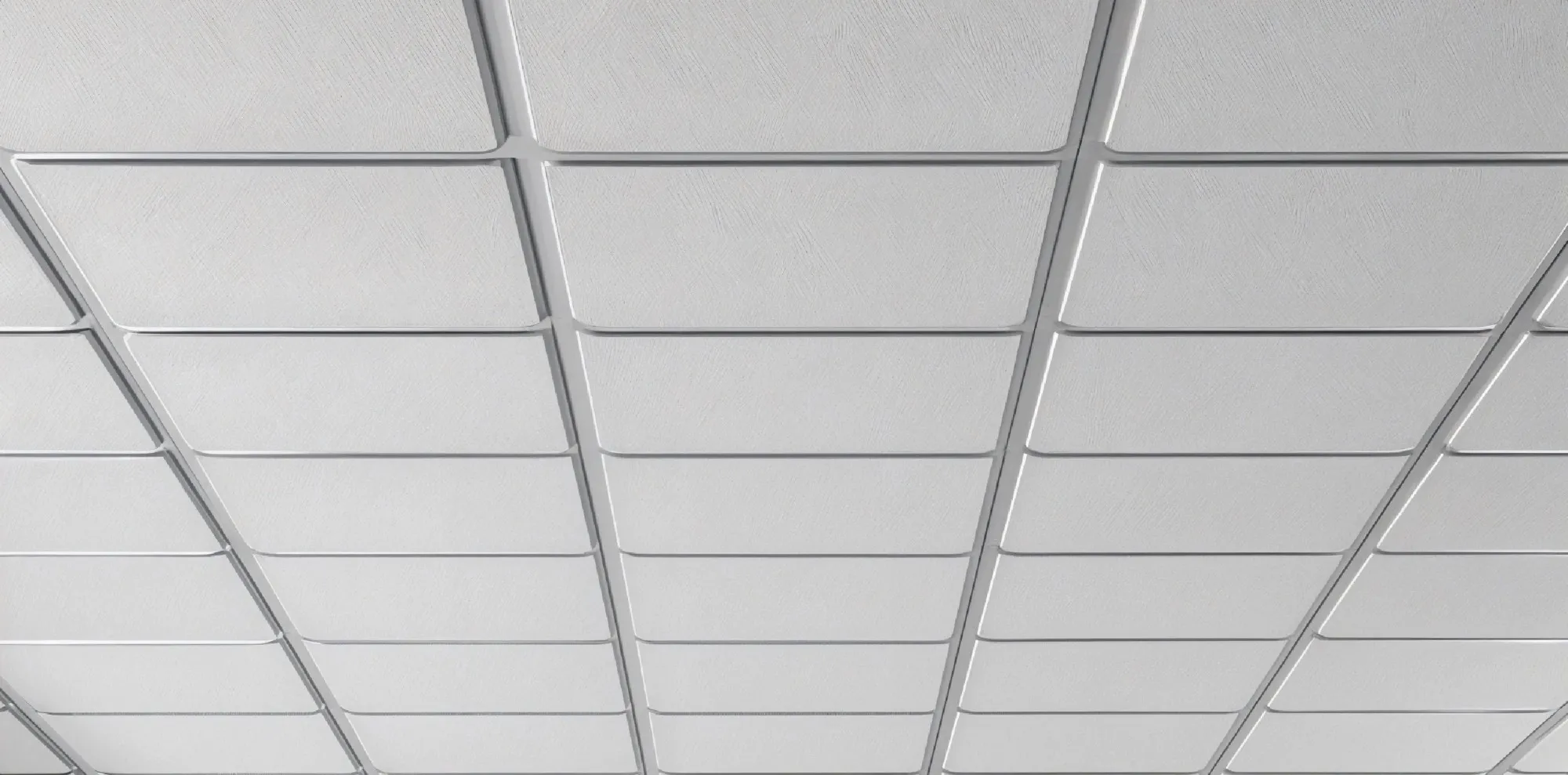 A white grid ceiling with lay-in tiles seen from below